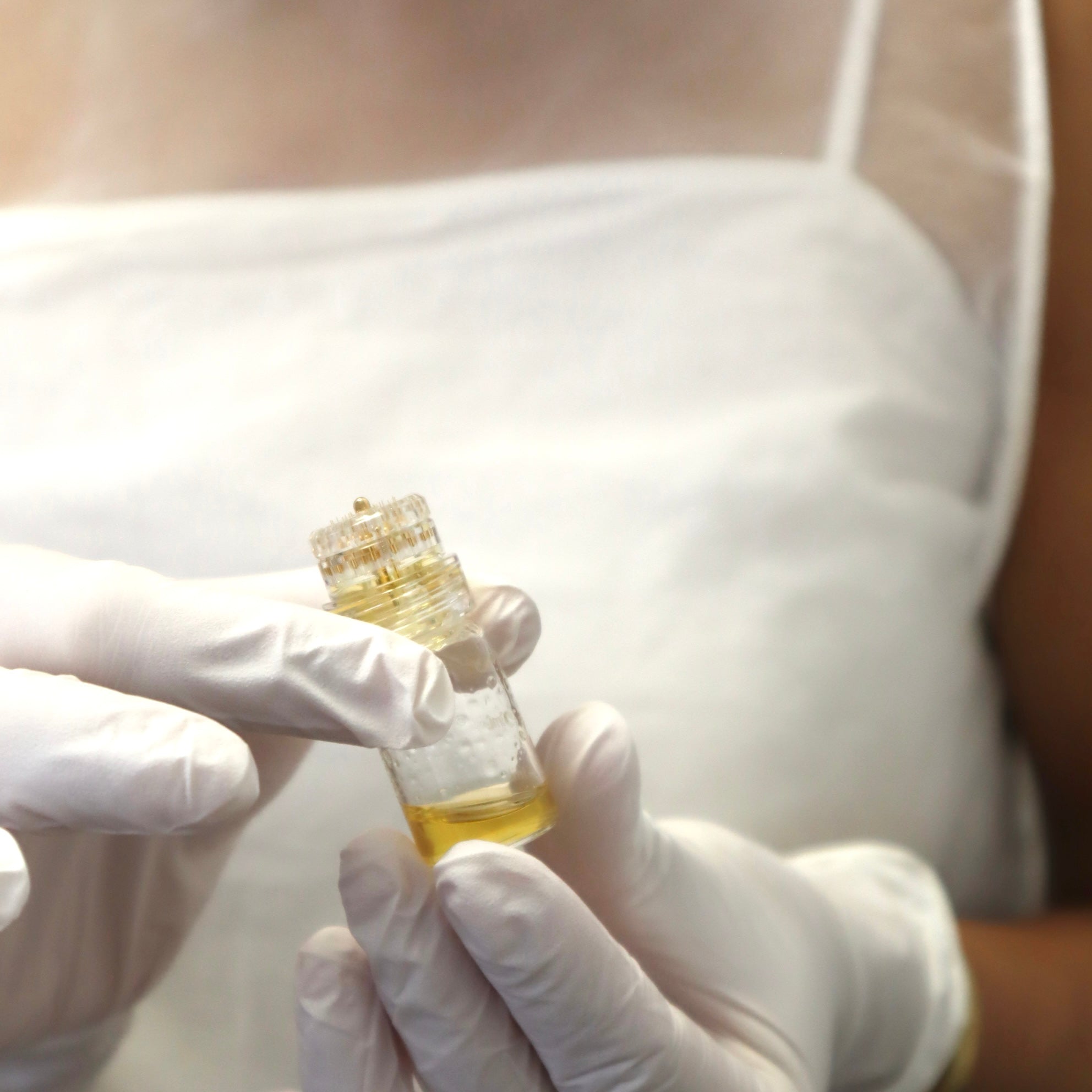 Gold infusion customized skin cocktail at Neat Studio for brightening, hydration, and rejuvenation, delivering a radiant and youthful complexion