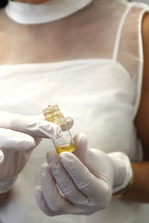 Gold infusion customized skin cocktail at Neat Studio for brightening, hydration, and rejuvenation, delivering a radiant and youthful complexion